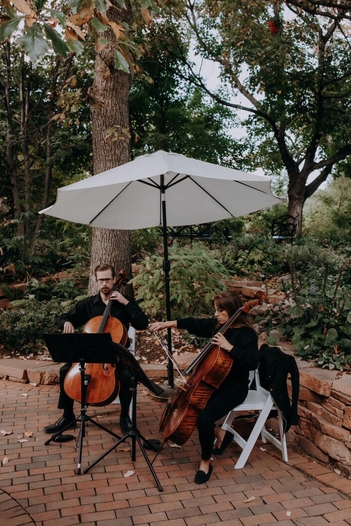 cello musicians play during the start of a wedding ceremony